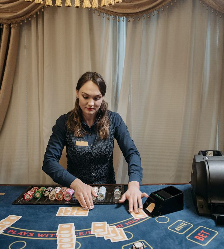 female croupier giving cards