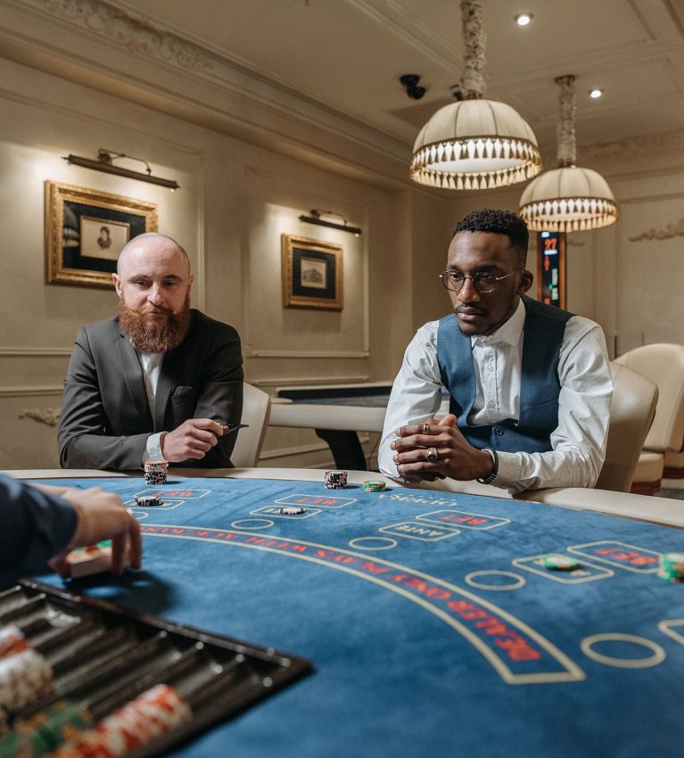 people playing table games in casino